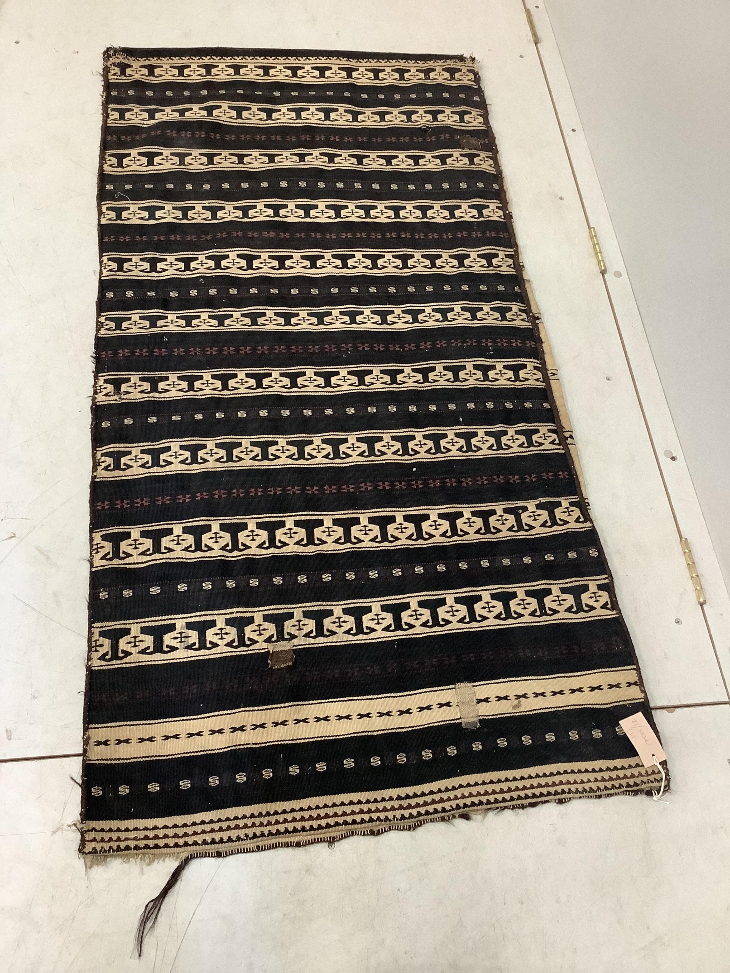 An Afghan flatweave salt bag, a double saddle bag and one other bag, largest approximately 120 x 80cm. Condition - fair to good